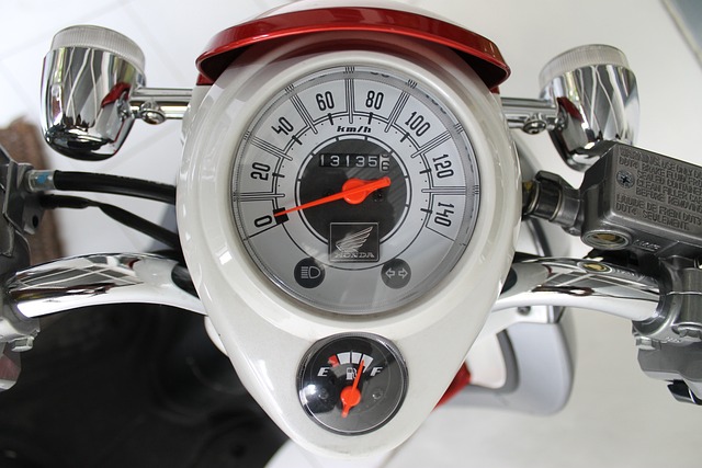 An image showcasing a close-up of a motorcycle speedometer being repaired, with a skilled mechanic delicately adjusting the needle and meticulously examining the internals, surrounded by various tools and a focused expression